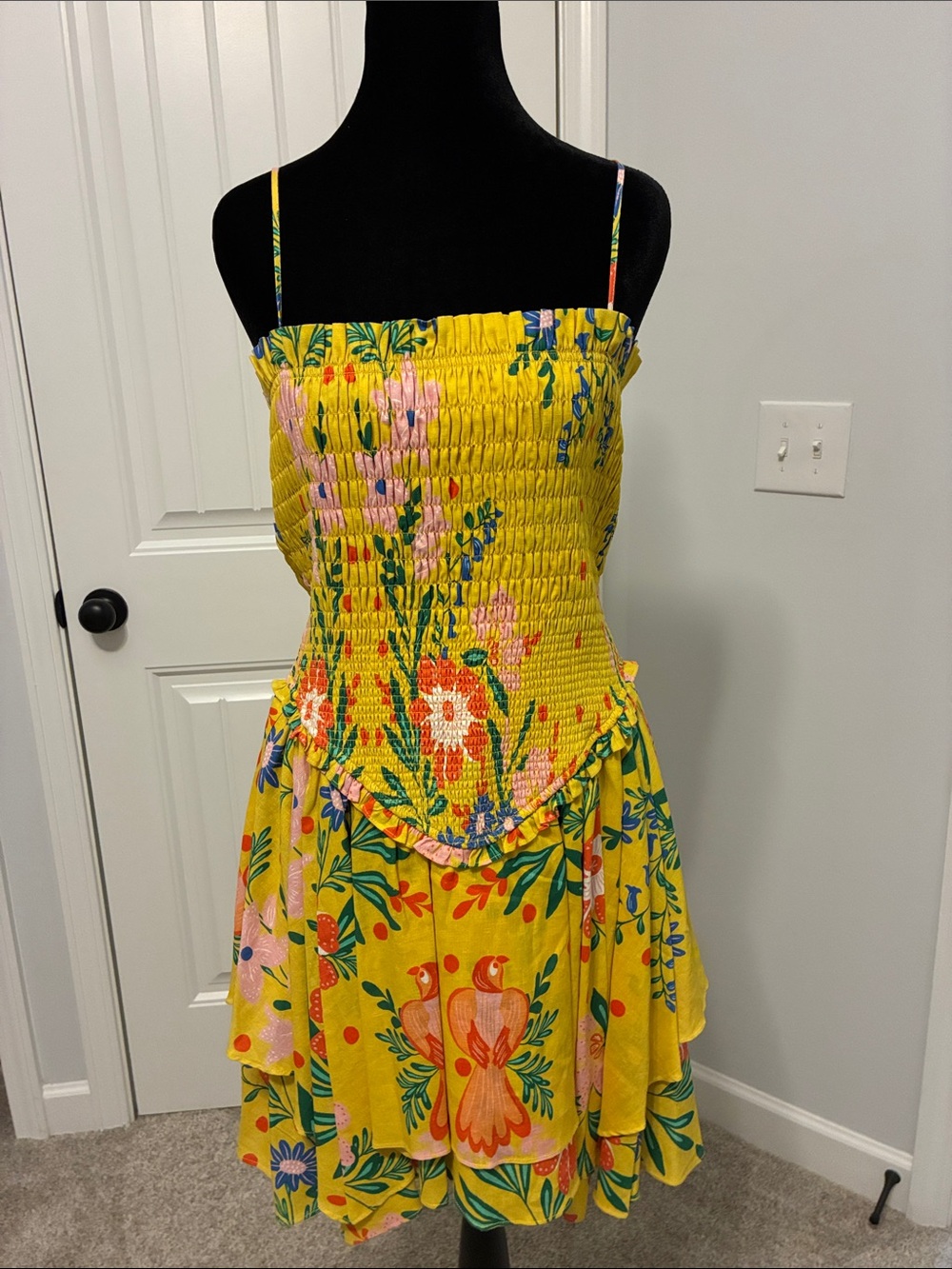 Yellow Floral Smocked Sundress with Spaghetti Straps
by Chelsea and Violet.